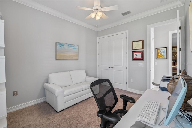 office area with ceiling fan, crown molding, and light carpet