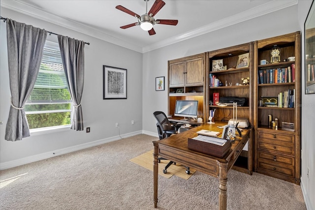 office space with light carpet, crown molding, ceiling fan, and a healthy amount of sunlight