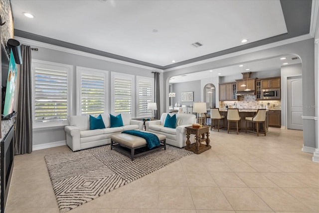 tiled living room with ornamental molding