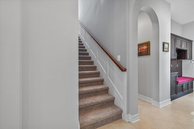 stairway featuring tile patterned floors