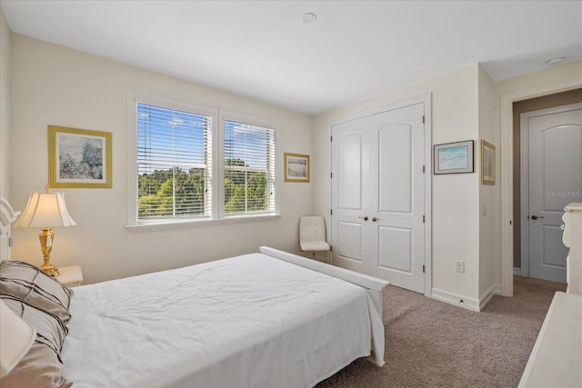 carpeted bedroom with a closet