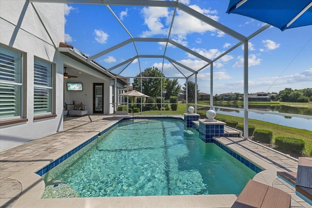 view of pool with a water view, a patio area, ceiling fan, and a lanai