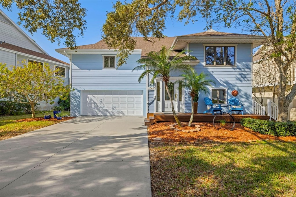 view of front facade featuring a garage and a front lawn