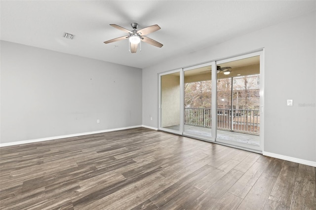 spare room featuring dark wood-type flooring