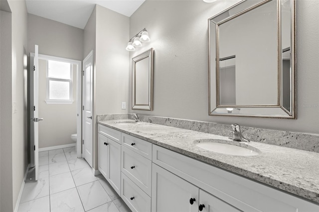 bathroom with vanity and toilet