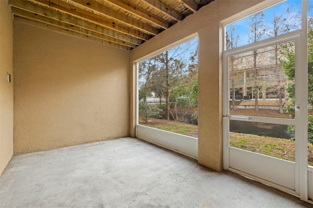 unfurnished sunroom featuring a healthy amount of sunlight