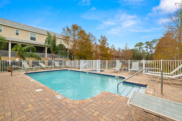 view of swimming pool featuring a patio