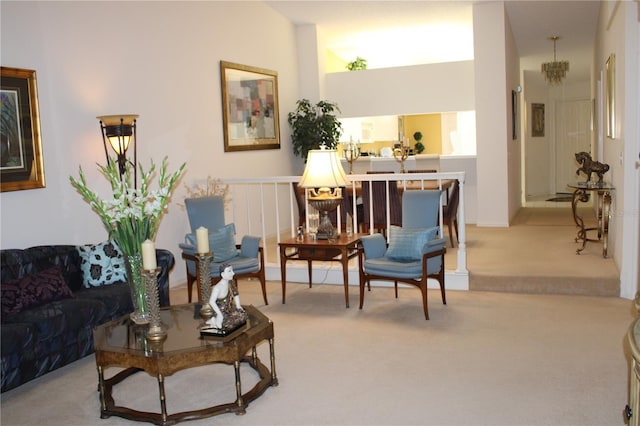 sitting room featuring light carpet