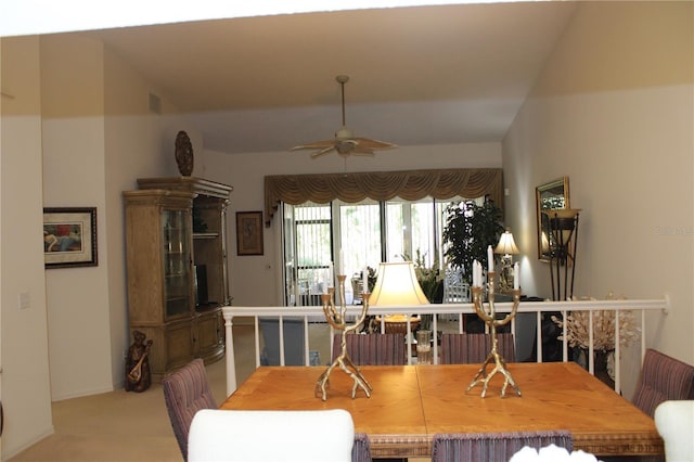 dining area featuring ceiling fan and carpet flooring