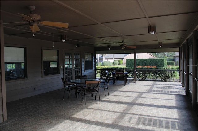 sunroom / solarium with ceiling fan