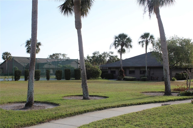 single story home featuring a front lawn