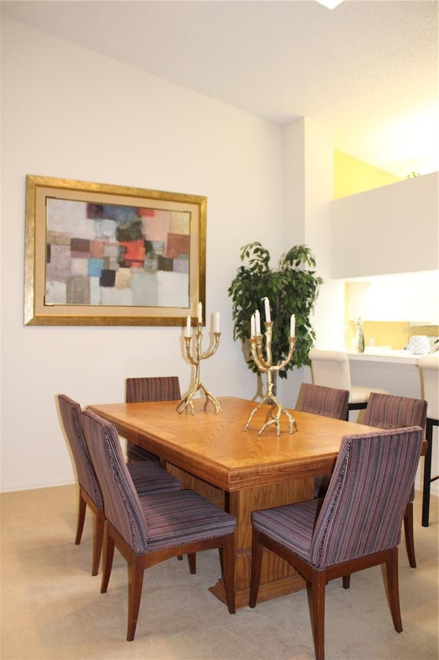 dining space with light colored carpet