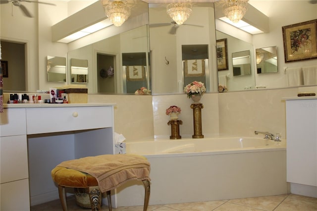 bathroom with vanity, a tub, tile patterned floors, and a chandelier