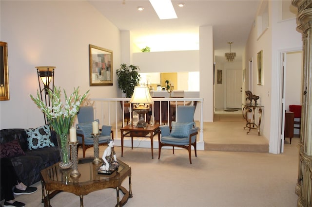 living area featuring a skylight and light colored carpet