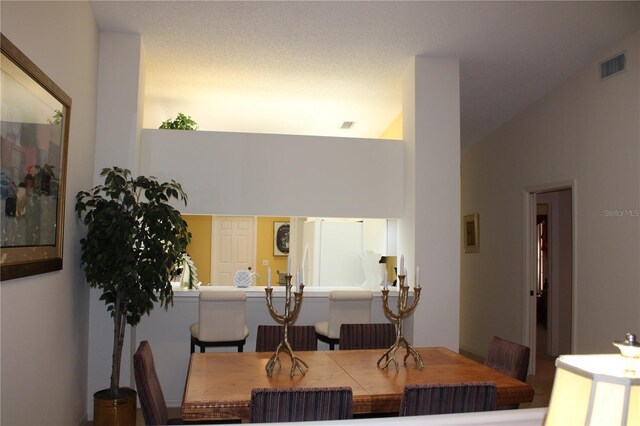 dining room featuring vaulted ceiling