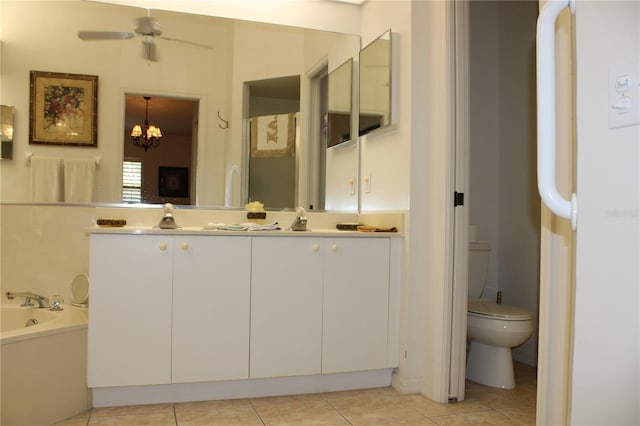 bathroom featuring toilet, vanity, tile patterned flooring, a tub to relax in, and ceiling fan with notable chandelier