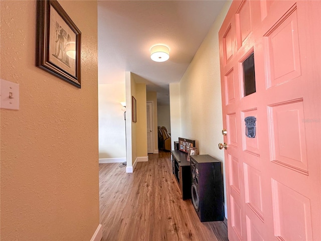 corridor featuring light hardwood / wood-style flooring