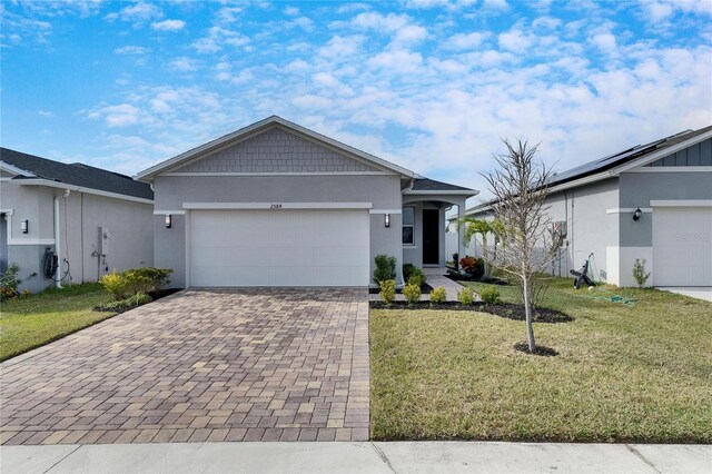 ranch-style house with a front lawn and a garage