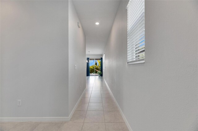 corridor with light tile patterned floors