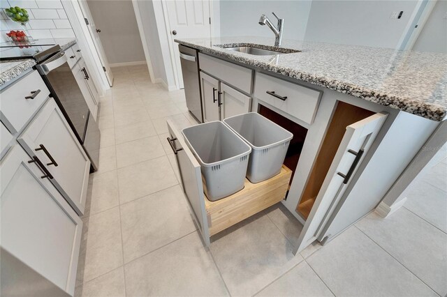 kitchen featuring white cabinetry, light stone countertops, sink, and stainless steel appliances