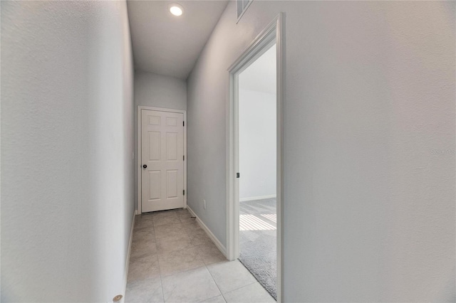 corridor with light tile patterned flooring