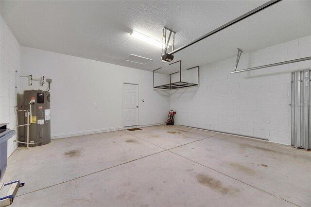 garage with a garage door opener and water heater