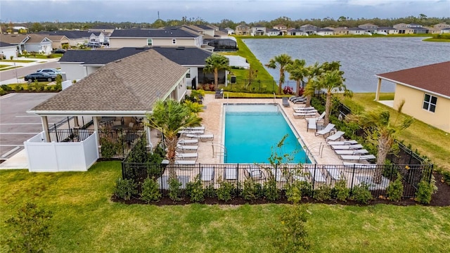 view of swimming pool featuring a lawn and a patio area