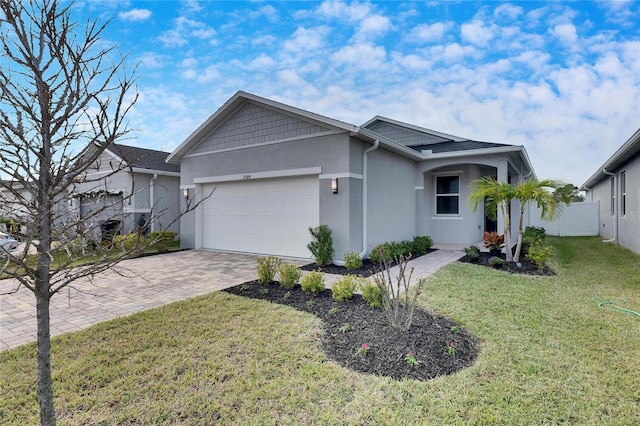 view of front of house with a front yard and a garage