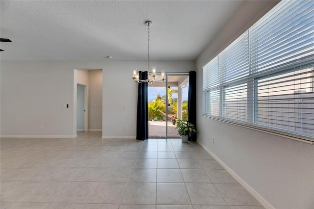 unfurnished dining area with light tile patterned flooring and a notable chandelier