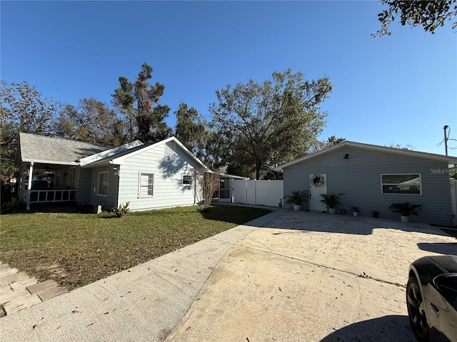 view of side of home featuring a yard