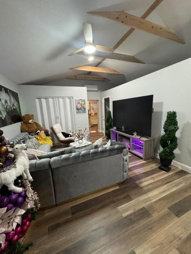 living room featuring wood-type flooring, lofted ceiling with beams, and ceiling fan