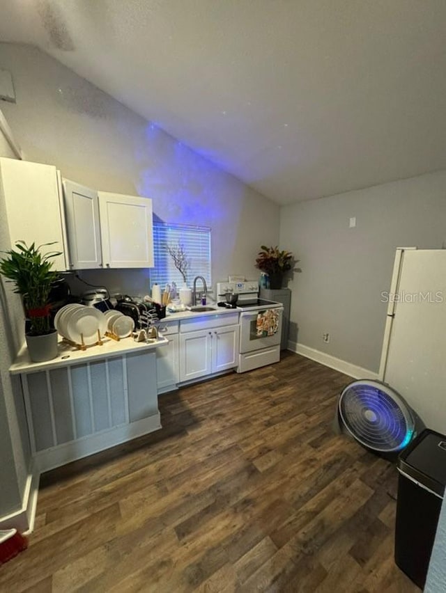 kitchen with range with electric cooktop, dark wood-type flooring, sink, white cabinets, and lofted ceiling