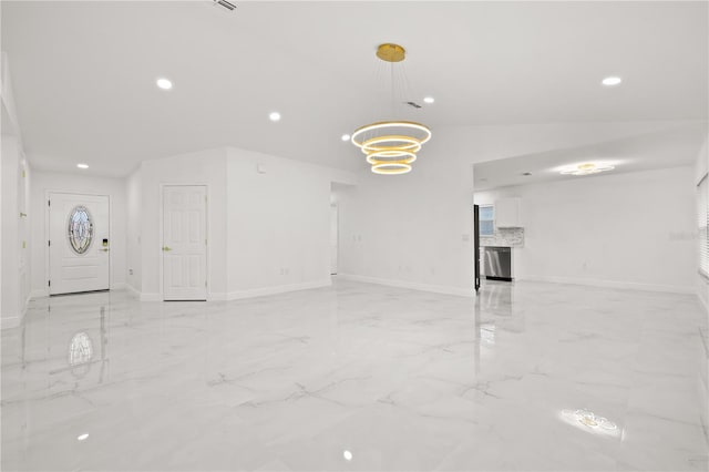 unfurnished living room featuring lofted ceiling