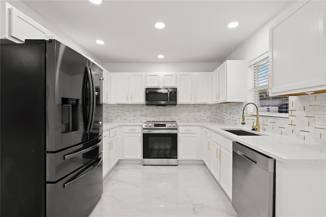 kitchen featuring backsplash, sink, white cabinetry, and stainless steel appliances