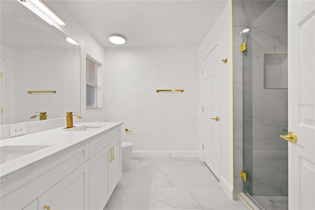 bathroom featuring vanity, toilet, and a shower with shower door