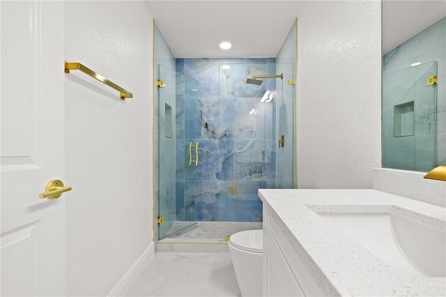 bathroom featuring vanity, toilet, and an enclosed shower