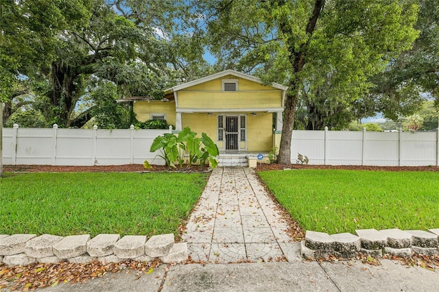 view of front of home featuring a front lawn and a porch