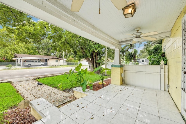 view of patio featuring ceiling fan