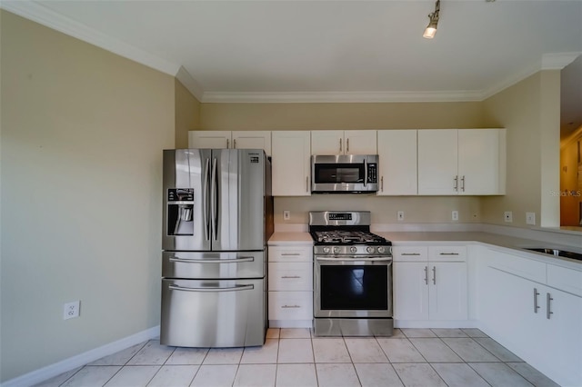 kitchen featuring light tile patterned flooring, white cabinetry, and appliances with stainless steel finishes