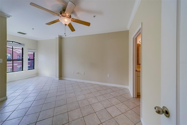 spare room featuring light tile patterned flooring, ceiling fan, and crown molding