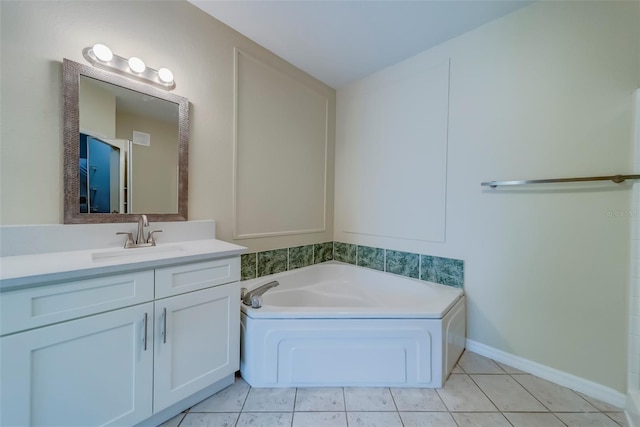 bathroom with vanity, tile patterned floors, and a bathtub