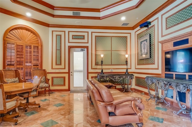 living area with crown molding