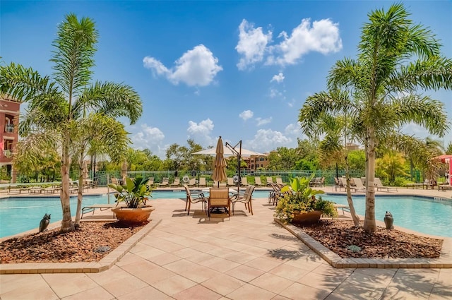 view of swimming pool with a patio