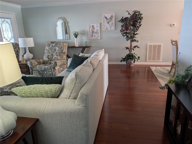 living room with crown molding and dark wood-type flooring