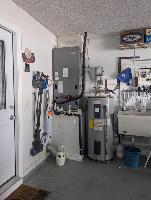 utility room with electric water heater and sink