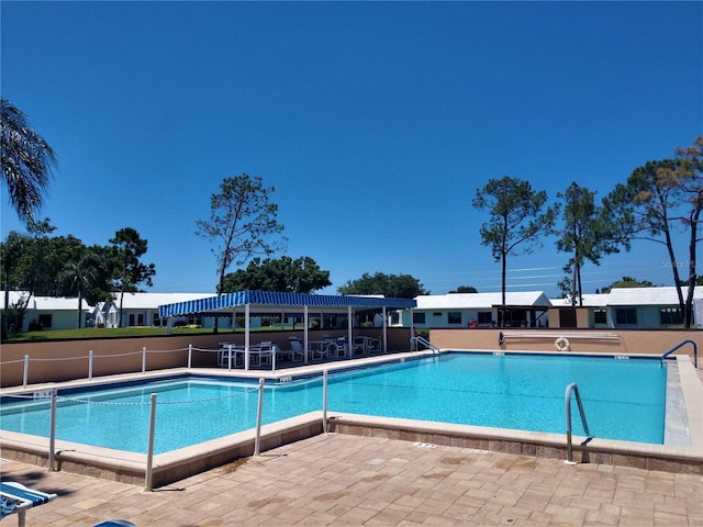 community pool featuring a patio area