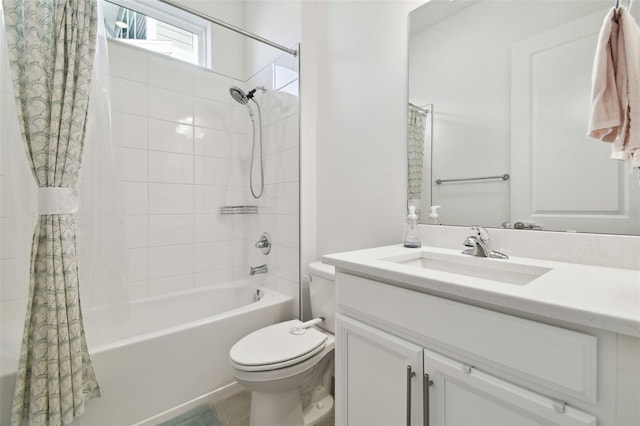 full bathroom featuring vanity, shower / bathtub combination with curtain, tile patterned floors, and toilet