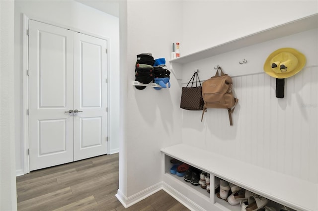 mudroom with light hardwood / wood-style floors