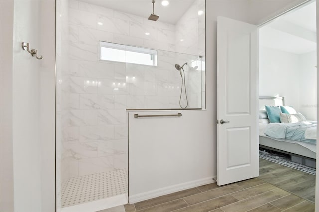 bathroom featuring a tile shower