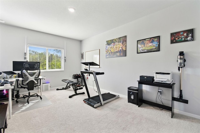 exercise room with light carpet